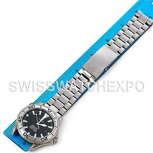 The image shows an Omega Seamaster 2231.50.00 Titanium Black Dial 2231.50.00 Titanium Black Dial watch laid flat, displaying the face, bezel, bracelet, and clasp from a top-down angle on a blue ruler.