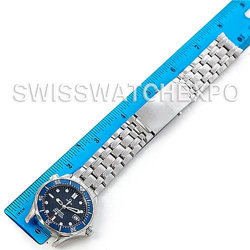 The Omega Seamaster 2223.80.00 Men's Stainless Steel Blue Dial 2223.80.00 Men's Stainless Steel Blue Dial watch is shown vertically with its dial, bezel, bracelet, and clasp visible, placed next to a blue ruler for scale.