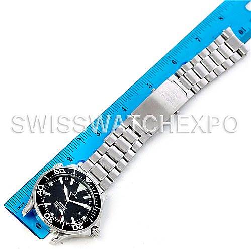 The Omega Seamaster 2254.50.00 Men
s Stainless Steel Black Dial 2254.50.00 Men
s Stainless Steel Black Dial watch is shown lying flat next to a blue ruler, displaying the face and metal bracelet.