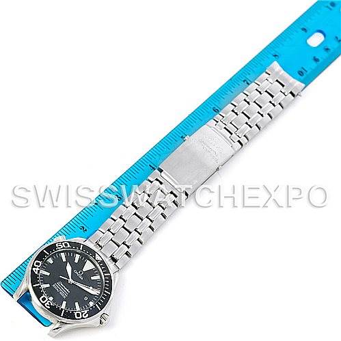 The Omega Seamaster 2054.50.00 Men
s Stainless Steel Black Dial 2054.50.00 Men
s Stainless Steel Black Dial watch is shown from a top-down angle, displaying the face, bezel, and full metal bracelet next to a blue ruler.