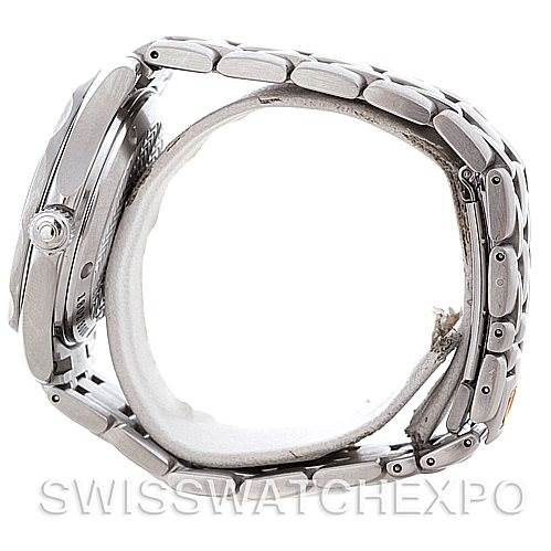 The image shows a side view of an Omega Seamaster 2553.41.00 Men's Stainless Steel Green Dial 2553.41.00 Men's Stainless Steel Green Dial watch, highlighting the case, crown, and metal bracelet.