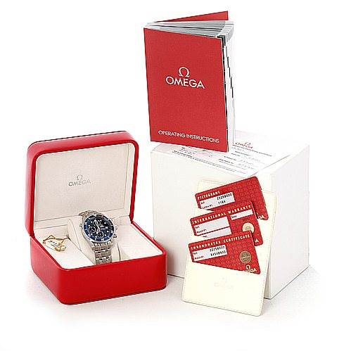 The image shows an Omega Seamaster 2225.80.00 Men's Stainless Steel Blue Dial 2225.80.00 Men's Stainless Steel Blue Dial watch in a red box, along with operating instructions and certification cards.