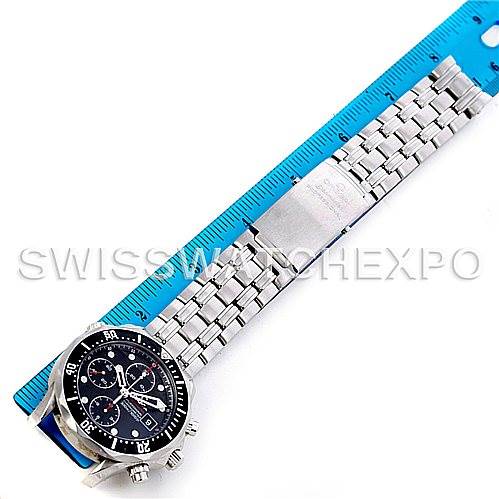 The Omega Seamaster 21330424001001 OR 213.30.42.40.01.001 Men's Stainless Steel Black Dial 21330424001001 OR 213.30.42.40.01.001 Men's Stainless Steel Black Dial watch is shown from a top-down angle, displaying the full length of the watch and its metal bracelet alongside a ruler.