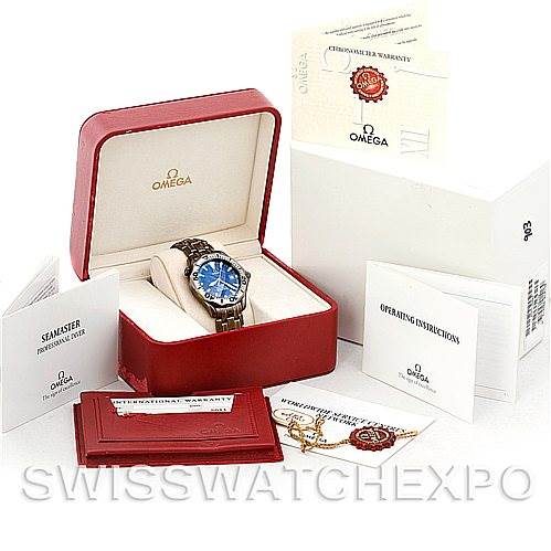 This image shows an Omega Seamaster 2231.80.00 Men's Titanium Blue Dial 2231.80.00 Men's Titanium Blue Dial watch with its box, manual, warranty card, and tags from a front angle.