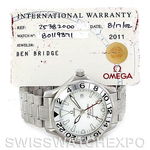 The image shows an Omega Seamaster 2538.20.00 Men
s Stainless Steel White Dial 2538.20.00 Men
s Stainless Steel White Dial watch at a front angle, along with its international warranty card.