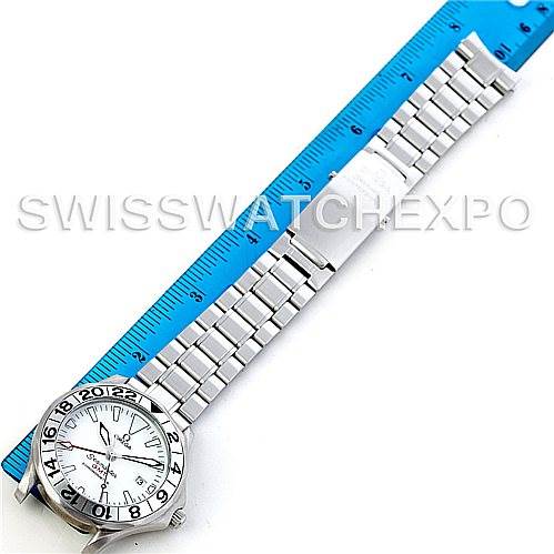 The image shows an Omega Seamaster 2538.20.00 Men
s Stainless Steel White Dial 2538.20.00 Men
s Stainless Steel White Dial watch laid flat, positioned diagonally, with a stainless steel bracelet next to a blue ruler.