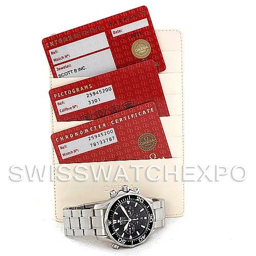 The image shows an Omega Seamaster 2594.52.00 Men's Stainless Steel Black Dial 2594.52.00 Men's Stainless Steel Black Dial watch and three red cards for certification and pictograms, displayed from an overhead angle.