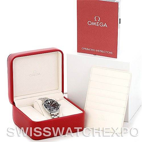 The image shows an Omega Seamaster 2254.50.00 Men
s Stainless Steel Black Dial 2254.50.00 Men
s Stainless Steel Black Dial watch in its case, with an operating manual and cardholder displayed beside it.