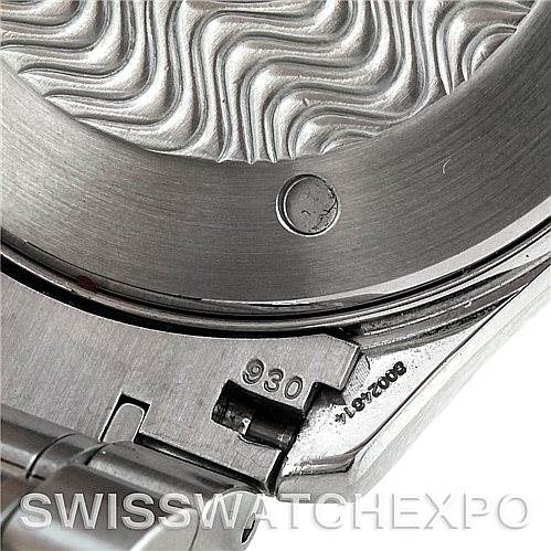 Close-up of the Omega Seamaster 2254.50.00 Men
s Stainless Steel Black Dial 2254.50.00 Men
s Stainless Steel Black Dial watch back and clasp displaying intricate wave pattern and specific markings.