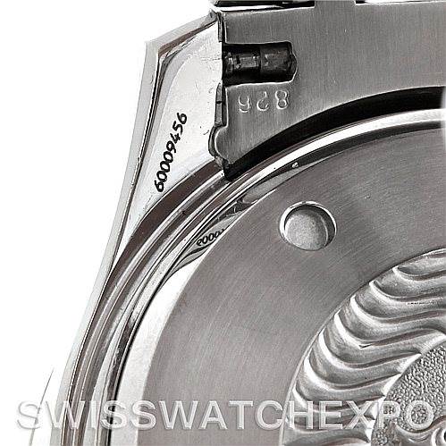 This image shows a close-up of the Omega Seamaster 2599.80.00 Men
s Stainless Steel Blue Dial 2599.80.00 Men
s Stainless Steel Blue Dial watch case back and part of the clasp with serial numbers engraved.