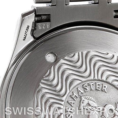 The image shows a close-up of the case back of an Omega Seamaster Men
s Stainless Steel Grey Dial Men
s Stainless Steel Grey Dial watch, highlighting its intricate engraving and part of the bracelet attachment.