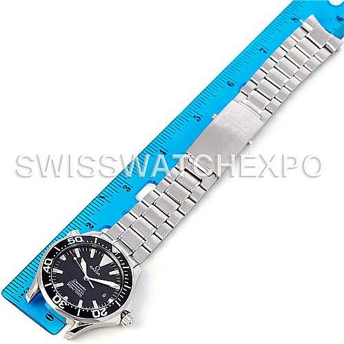 The image shows an Omega Seamaster 2254.50.00 Men
s Stainless Steel Black Dial 2254.50.00 Men
s Stainless Steel Black Dial watch laid flat next to a blue ruler, displaying its face and metal bracelet in a top-down angle.
