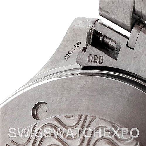 The image shows a close-up of the clasp and part of the case back of an Omega Seamaster 2254.50.00 Men
s Stainless Steel Black Dial 2254.50.00 Men
s Stainless Steel Black Dial watch, highlighting detailed engravings.