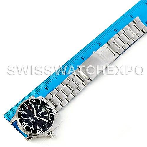 The Omega Seamaster 2252.50.00 Men
s Stainless Steel Black Dial 2252.50.00 Men
s Stainless Steel Black Dial watch is shown flat with its face and bracelet aligned next to a blue ruler for scale.