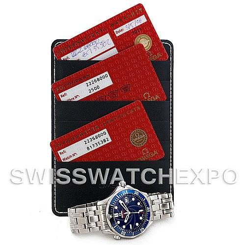 The image shows an Omega Seamaster 2226.80.00 Men
s Stainless Steel Blue Dial 2226.80.00 Men
s Stainless Steel Blue Dial watch with cards and a holder, viewed from above.