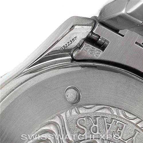 The image shows a close-up of the Omega Seamaster 2234.50.00 Men
s Stainless Steel Black Dial 2234.50.00 Men
s Stainless Steel Black Dial watch clasp and serial number plate with part of the engraved case back.