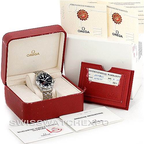 The image shows an Omega Seamaster 2234.50.00 Men
s Stainless Steel Black Dial 2234.50.00 Men
s Stainless Steel Black Dial watch in its box, accompanied by warranty cards and instruction booklets.