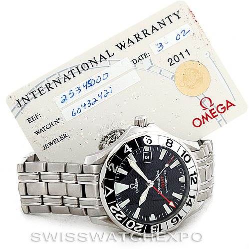 The image shows an Omega Seamaster 2234.50.00 Men
s Stainless Steel Black Dial 2234.50.00 Men
s Stainless Steel Black Dial watch with a visible international warranty card in the background, including the model and reference numbers.