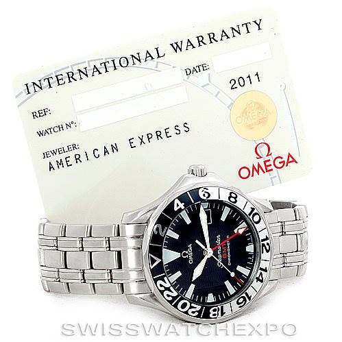 The image shows an Omega Seamaster 2234.50.00 Men
s Stainless Steel Black Dial 2234.50.00 Men
s Stainless Steel Black Dial watch from a front angle, along with its international warranty card.
