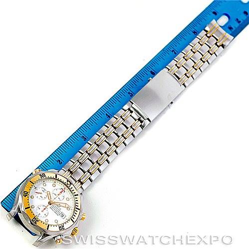 This image shows an Omega Seamaster 2398.20.00 Men's Steel and Gold (two tone) White Dial 2398.20.00 Men's Steel and Gold (two tone) White Dial watch laid flat with a blue ruler beside it.