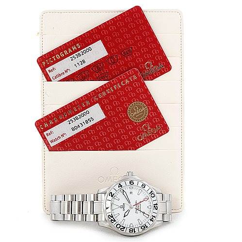 The image shows an Omega Seamaster 2538.20.00 Men
s Stainless Steel White Dial 2538.20.00 Men
s Stainless Steel White Dial watch along with two red certification cards and a holder, viewed from above.
