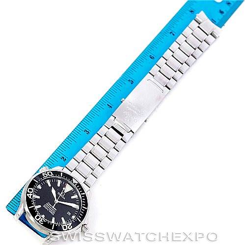 The image shows an overhead view of an Omega Seamaster 2254.50.00 Men
s Stainless Steel Black Dial 2254.50.00 Men
s Stainless Steel Black Dial watch, including its face, bezel, and metal bracelet, placed alongside a ruler.