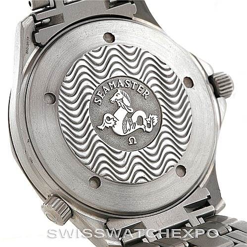 The image shows the case back of an Omega Seamaster 2231.80.00 Men
s Titanium Blue Dial 2231.80.00 Men
s Titanium Blue Dial watch, featuring the Seamonster engraving and a portion of the metal bracelet.