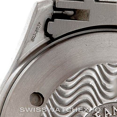 This image shows a close-up of the back case and part of the bracelet of an Omega Seamaster 2231.80.00 Men
s Titanium Blue Dial 2231.80.00 Men
s Titanium Blue Dial watch.