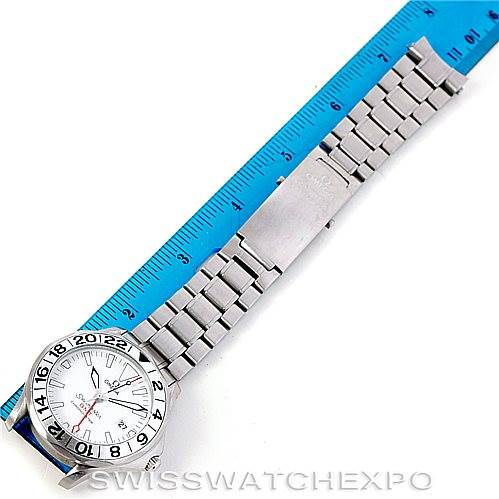 The image shows an Omega Seamaster 2538.20.00 Men
s Stainless Steel White Dial 2538.20.00 Men
s Stainless Steel White Dial watch from an overhead angle, with the watch lying flat next to a blue ruler.