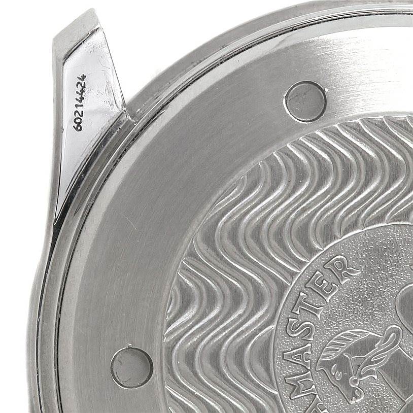 The image focuses on the back case of an Omega Seamaster 2532.80.00 Men's Stainless Steel Grey Dial 2532.80.00 Men's Stainless Steel Grey Dial watch, showing the intricate wave design and part of a lug.