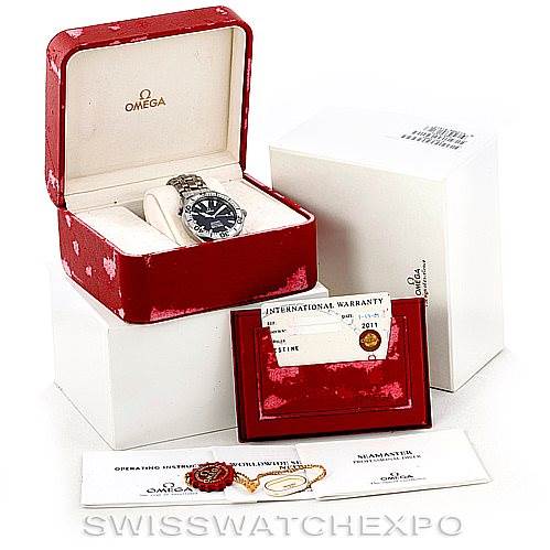 The image shows an Omega Seamaster 2031.50.00 Men
s Titanium Black Dial 2031.50.00 Men
s Titanium Black Dial watch with its open box, warranty card, operating instructions, and accessories from a frontal angle.