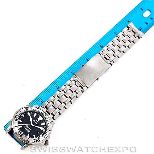 The image shows the Omega Seamaster 2031.50.00 Men
s Titanium Black Dial 2031.50.00 Men
s Titanium Black Dial watch laid flat, displaying the face, bezel, and steel bracelet alongside a blue ruler for scale.