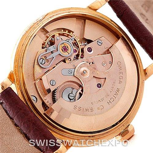 The image shows the inner workings and movement of the Omega Seamaster 315.164 Men's Rose Gold Silver Dial 315.164 Men's Rose Gold Silver Dial watch, specifically its mechanical components from the back angle.