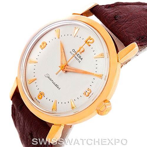 The image shows a close-up of the Omega Seamaster 315.164 Men's Rose Gold Silver Dial 315.164 Men's Rose Gold Silver Dial watch, highlighting its gold casing, white dial, and brown leather strap.