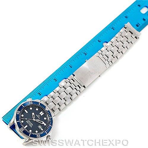 The image shows an Omega Seamaster 2541.80.00 Men
s Stainless Steel Blue Dial 2541.80.00 Men
s Stainless Steel Blue Dial watch laying flat, with its face, bezel, and metal bracelet visible next to a blue ruler.