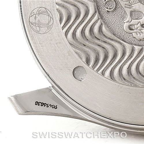 This image shows the case back of an Omega Seamaster 2264.50.00 Men
s Stainless Steel Black Dial 2264.50.00 Men
s Stainless Steel Black Dial watch, highlighting the engraved wave pattern and partial branding elements.