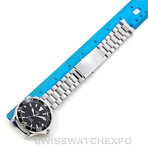 The image shows the Omega Seamaster 2264.50.00 Men
s Stainless Steel Black Dial 2264.50.00 Men
s Stainless Steel Black Dial watch laid flat next to a blue ruler, displaying the face, bezel, and stainless steel bracelet.