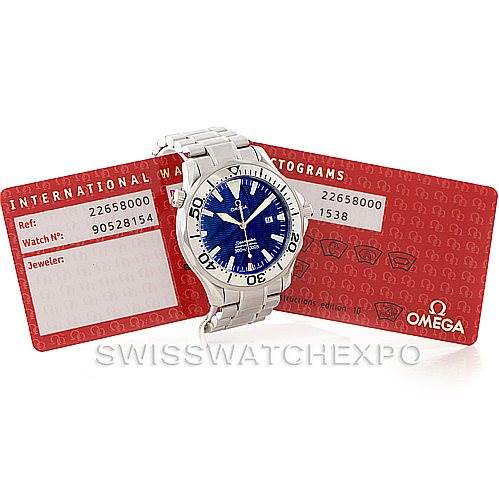 The image shows an Omega Seamaster 2265.80.00 Men
s Stainless Steel Blue Dial 2265.80.00 Men
s Stainless Steel Blue Dial watch at an angle displaying the dial and bracelet, accompanied by red certification cards.