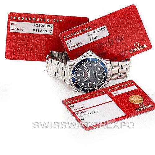 The image shows the Omega Seamaster 2220.80.00 Men
s Stainless Steel Blue Dial 2220.80.00 Men
s Stainless Steel Blue Dial watch at an angle that highlights the watch face and bracelet, along with its certification cards.