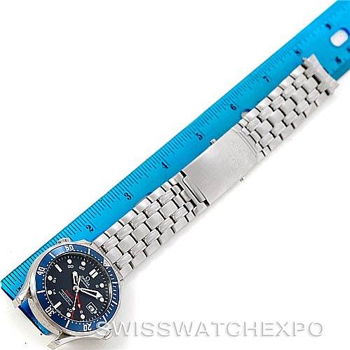 The image shows an Omega Seamaster 2535.80.00 Men
s Stainless Steel Blue Dial 2535.80.00 Men
s Stainless Steel Blue Dial watch laid flat next to a ruler, displaying its face and metal bracelet.