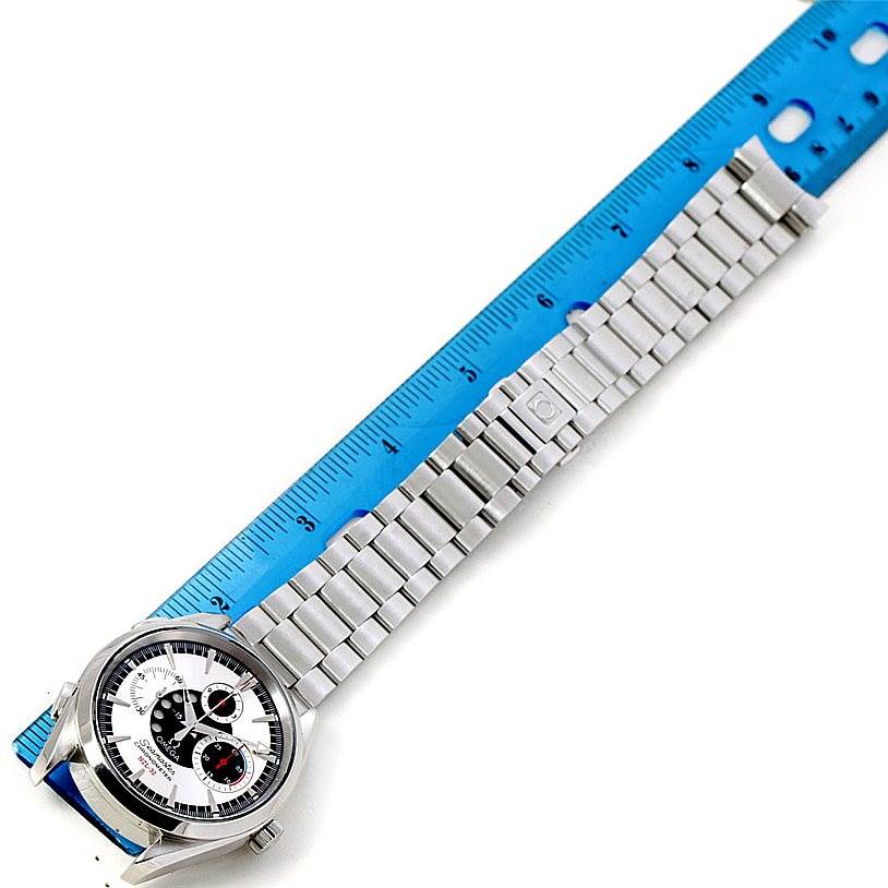 The photo shows an overhead view of an Omega Seamaster 2513.30.00 Men
s Stainless Steel Silver Dial 2513.30.00 Men
s Stainless Steel Silver Dial watch with its bracelet laid alongside a ruler.