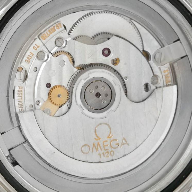 The image shows the internal mechanics of an Omega Seamaster 2533.50.00 Men
s Stainless Steel Black Dial 2533.50.00 Men
s Stainless Steel Black Dial watch, including gears and the rotor, viewed from the back.
