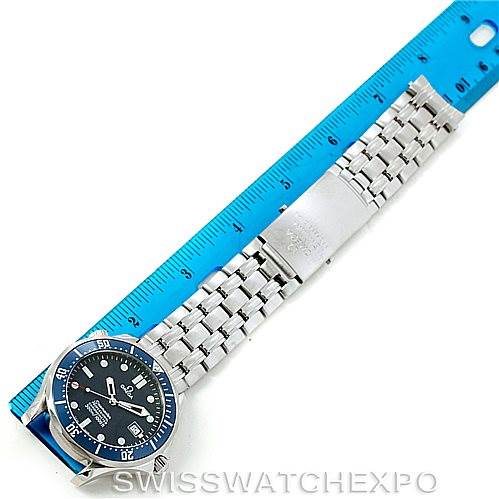 This image shows an Omega Seamaster 2531.80.00 Men
s Stainless Steel Blue Dial 2531.80.00 Men
s Stainless Steel Blue Dial watch laid flat with a blue ruler next to it, displaying its full length.