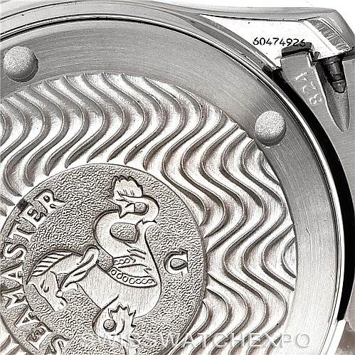 This image shows the back case of an Omega Seamaster 2551.80.00 Men
s Stainless Steel Blue Dial 2551.80.00 Men
s Stainless Steel Blue Dial watch, featuring its distinct wavy pattern and logo engraving.