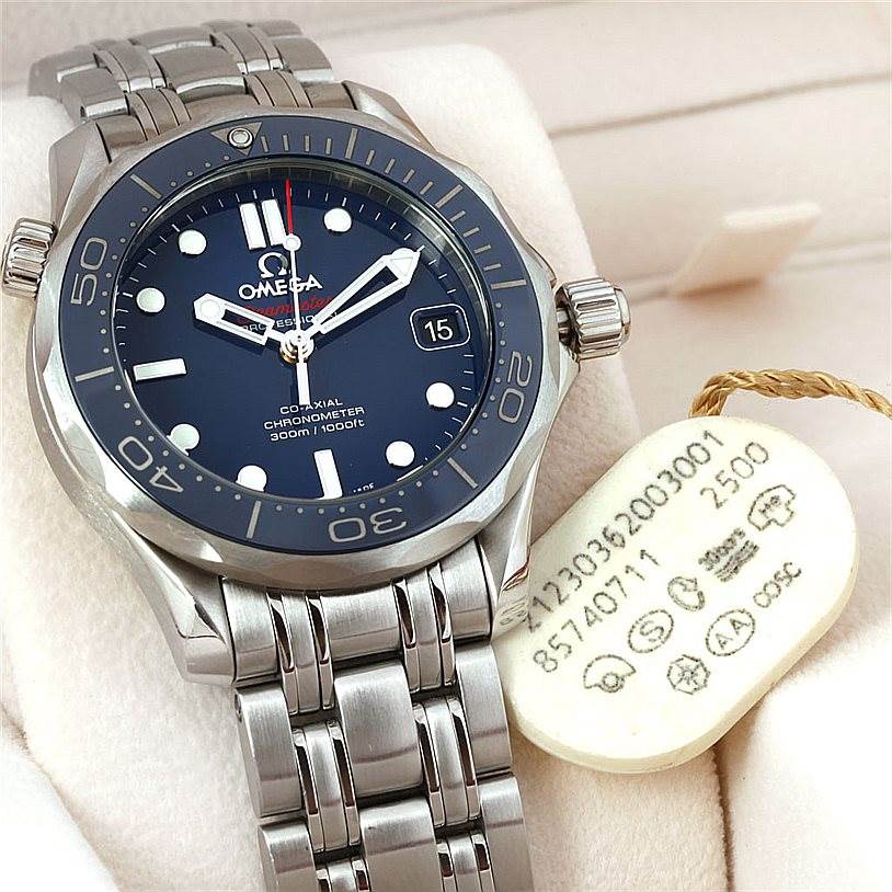 The image shows a front angle of an Omega Seamaster 212.30.36.20.03.001 Men
s Stainless Steel Blue Dial 212.30.36.20.03.001 Men
s Stainless Steel Blue Dial watch with a stainless steel bracelet and a visible price tag.