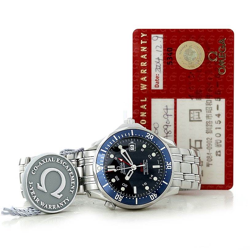 The Omega Seamaster 2535.80.00 Men
s Stainless Steel Blue Dial 2535.80.00 Men
s Stainless Steel Blue Dial watch is shown from a front angle with its bracelet, 3-year warranty tag, and warranty card included.