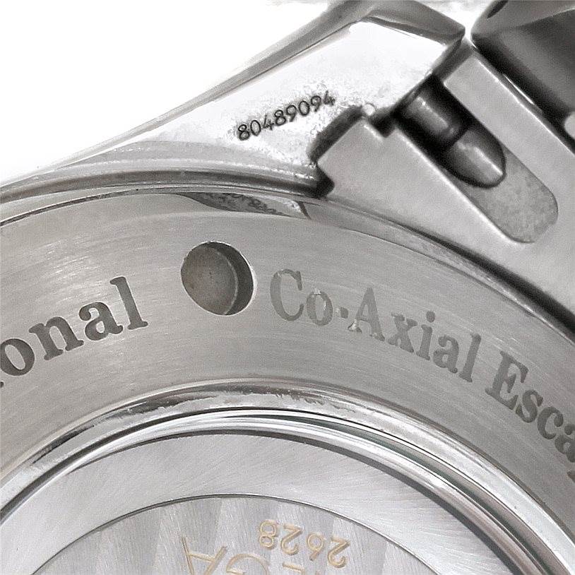 The image shows a close-up of the back case and part of the strap of an Omega Seamaster 2535.80.00 Men
s Stainless Steel Blue Dial 2535.80.00 Men
s Stainless Steel Blue Dial watch, focusing on the engraved text and serial number.