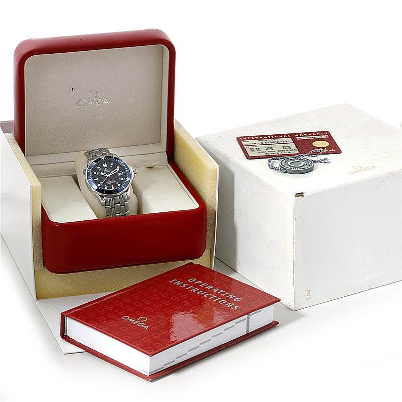 The Omega Seamaster 2535.80.00 Men
s Stainless Steel Blue Dial 2535.80.00 Men
s Stainless Steel Blue Dial watch is displayed at a front angle in its box, accompanied by operating instructions and a warranty card.