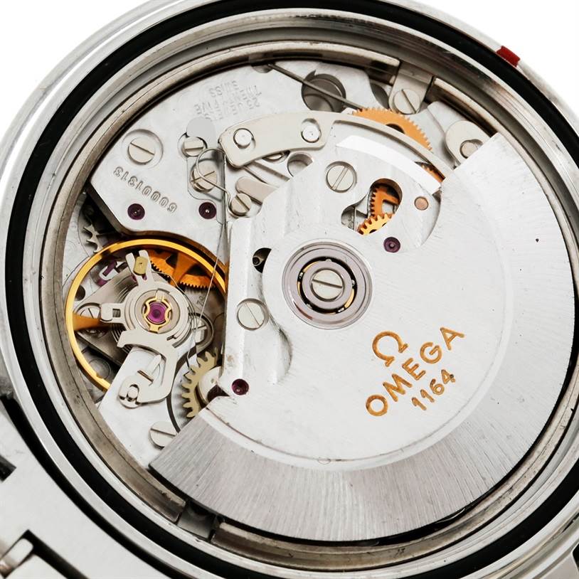 This image shows the movement and intricate inner workings of an Omega Seamaster 2599.80.00 Men
s Stainless Steel Blue Dial 2599.80.00 Men
s Stainless Steel Blue Dial watch, focusing on the Omega 1164 mechanism.