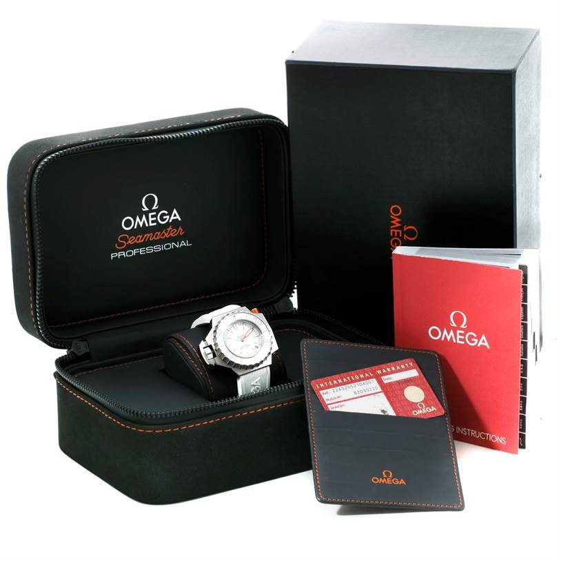 The image shows the Omega Seamaster Ploprof watch with its open case, warranty card, and instruction manual.